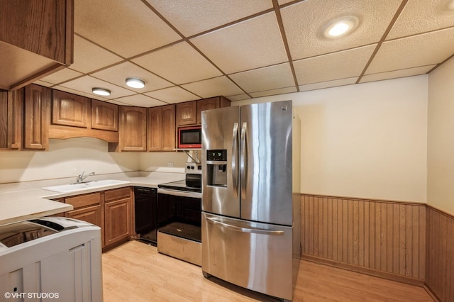 3325 Kirchoff Rd Unit 3E, Rolling Meadows, IL 60008 - kitchen featuring stainless steel appliances, light wood-style flooring, wainscoting, a paneled ceiling, and light countertops