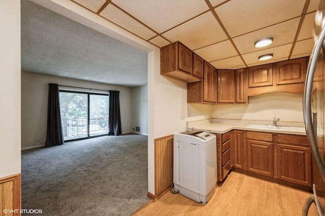 3325 Kirchoff Rd Unit 3E, Rolling Meadows, IL 60008 - kitchen with stainless steel fridge, open floor plan, light countertops, and brown cabinets