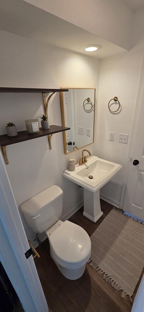 5406 N Arrow Dr, Peoria, IL 61614 - half bath with toilet and wood finished floors
