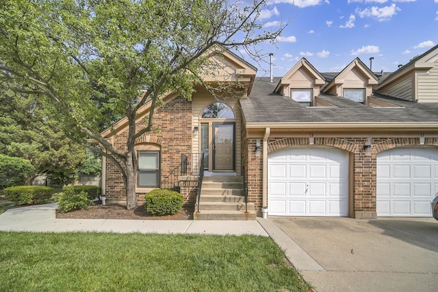 13 Willow Pkwy, Buffalo Grove, IL 60089 - view of front of house with an attached garage, brick siding, driveway, and a shingled roof