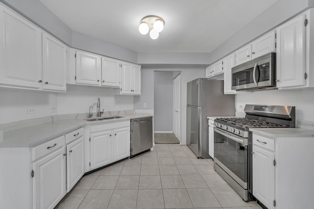 13 Willow Pkwy, Buffalo Grove, IL 60089 - kitchen with stainless steel appliances, white cabinets, and light tile patterned floors