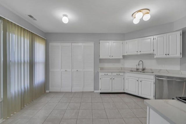 13 Willow Pkwy, Buffalo Grove, IL 60089 - kitchen featuring dishwasher, white cabinetry, light stone countertops, and light tile patterned flooring