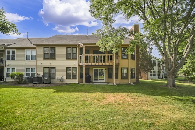 13 Willow Pkwy, Buffalo Grove, IL 60089 - rear view of house with a chimney, a lawn, and a patio area