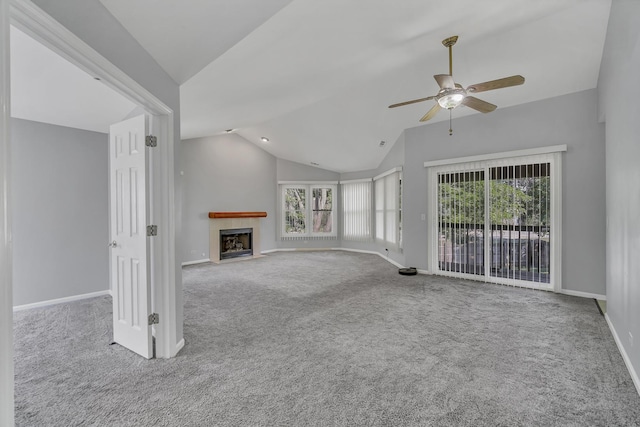 13 Willow Pkwy, Buffalo Grove, IL 60089 - unfurnished living room featuring carpet flooring, vaulted ceiling, a ceiling fan, and plenty of natural light
