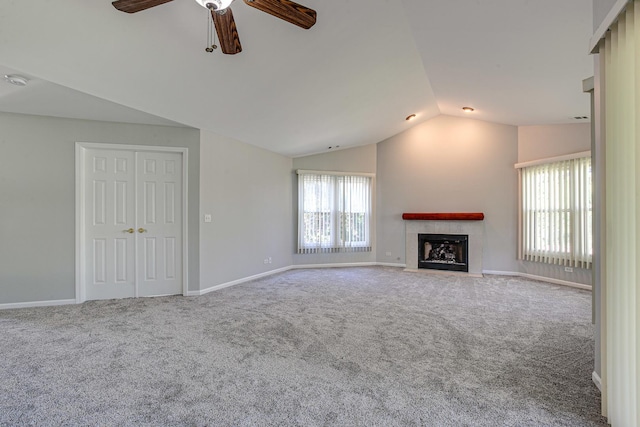 13 Willow Pkwy, Buffalo Grove, IL 60089 - unfurnished living room featuring lofted ceiling, a ceiling fan, carpet flooring, and a fireplace with flush hearth