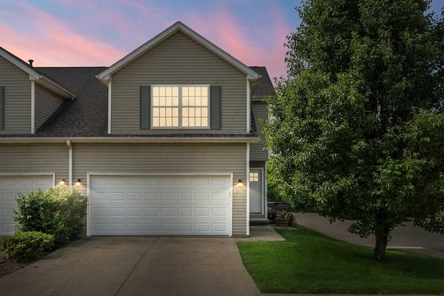 1201 Riviera Dr, Bloomington, IL 61701 - view of front facade with concrete driveway, a front yard, a shingled roof, and a garage