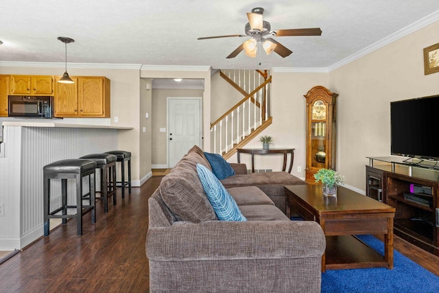 1201 Riviera Dr, Bloomington, IL 61701 - living room featuring dark wood-style flooring, stairway, ceiling fan, and ornamental molding