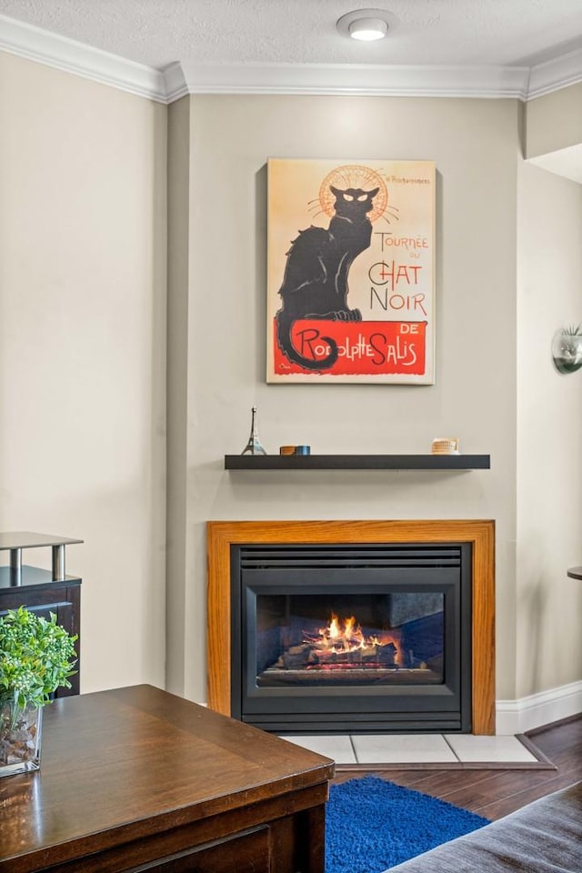 1201 Riviera Dr, Bloomington, IL 61701 - detailed view of a glass covered fireplace, ornamental molding, and wood finished floors