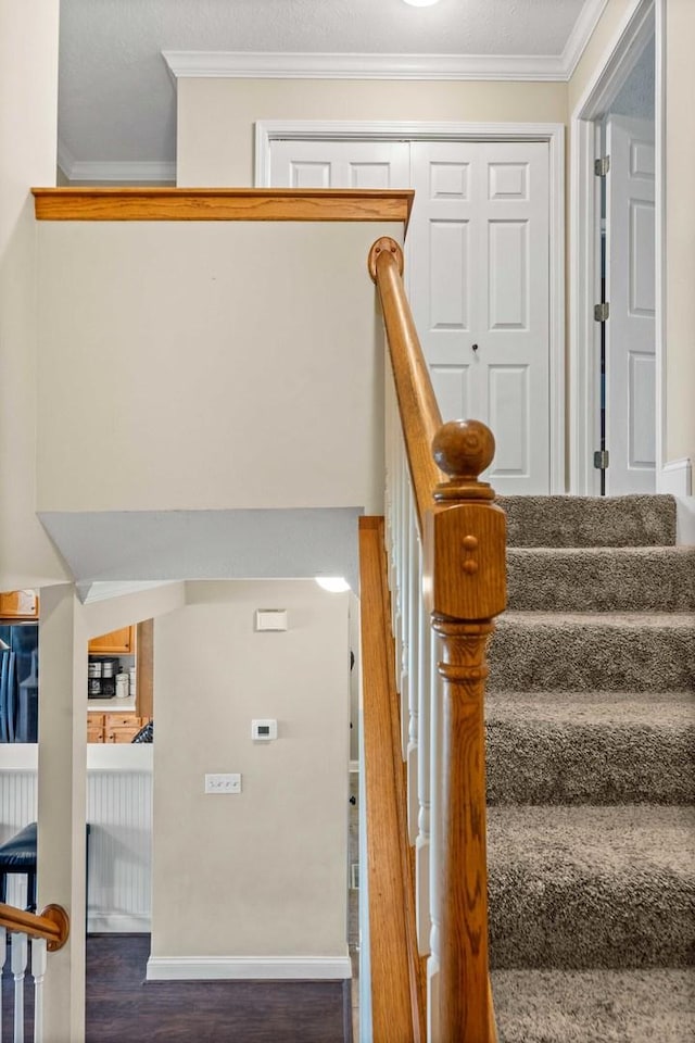 1201 Riviera Dr, Bloomington, IL 61701 - stairs with crown molding and wood finished floors