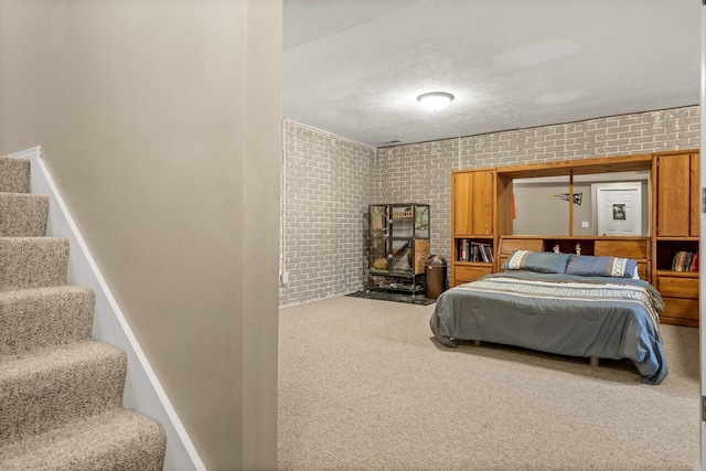 1201 Riviera Dr, Bloomington, IL 61701 - carpeted bedroom with brick wall