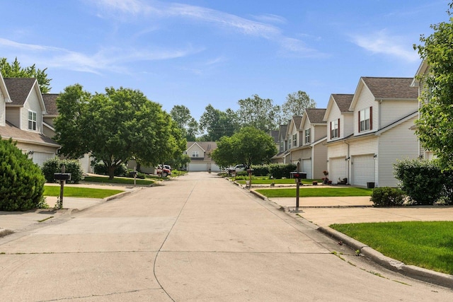 1201 Riviera Dr, Bloomington, IL 61701 - view of concrete road with a residential view and curbs