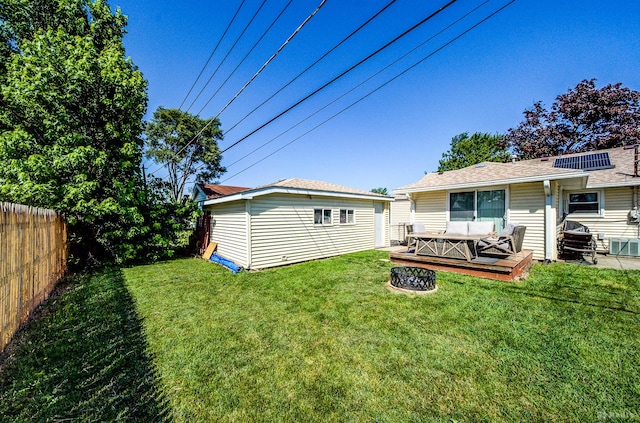 4209 SW Hwy Unit 4209, Hometown, IL 60456 - rear view of house featuring a fenced backyard, an outdoor structure, a deck, and a fire pit