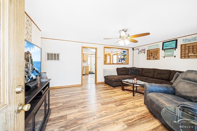 4209 SW Hwy Unit 4209, Hometown, IL 60456 - living area with ceiling fan, light wood-style floors, and ornamental molding