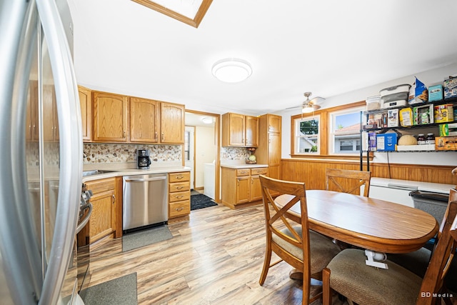 4209 SW Hwy Unit 4209, Hometown, IL 60456 - kitchen with appliances with stainless steel finishes, light wood-style floors, light countertops, tasteful backsplash, and ceiling fan