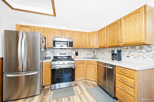 4209 SW Hwy Unit 4209, Hometown, IL 60456 - kitchen featuring appliances with stainless steel finishes, light wood finished floors, light countertops, and tasteful backsplash