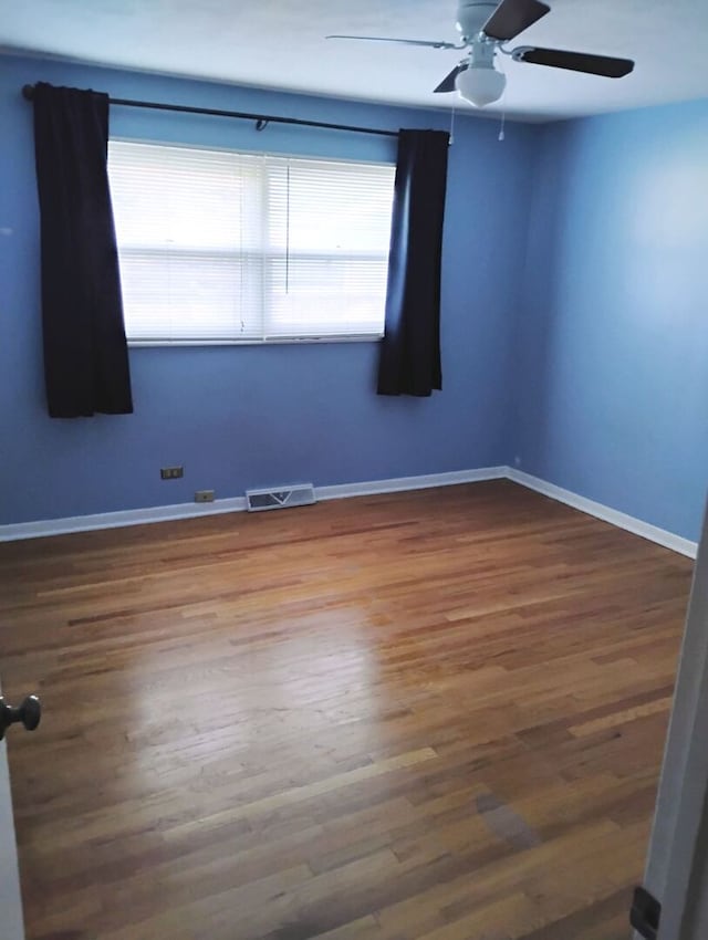 1544 Towhee Ln, Naperville, IL 60565 - spare room featuring ceiling fan and wood finished floors