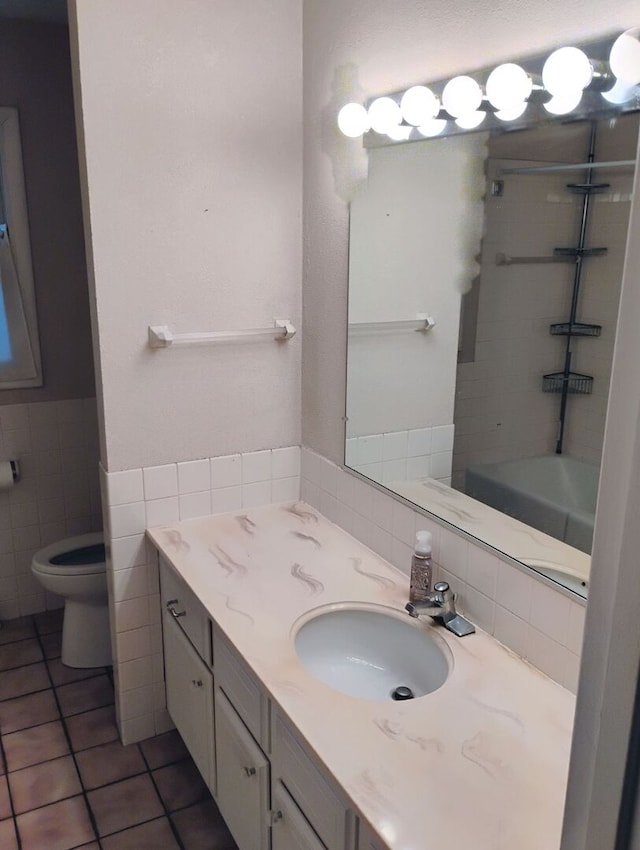 1544 Towhee Ln, Naperville, IL 60565 - full bathroom featuring tile walls, tile patterned floors, vanity, wainscoting, and bathtub / shower combination
