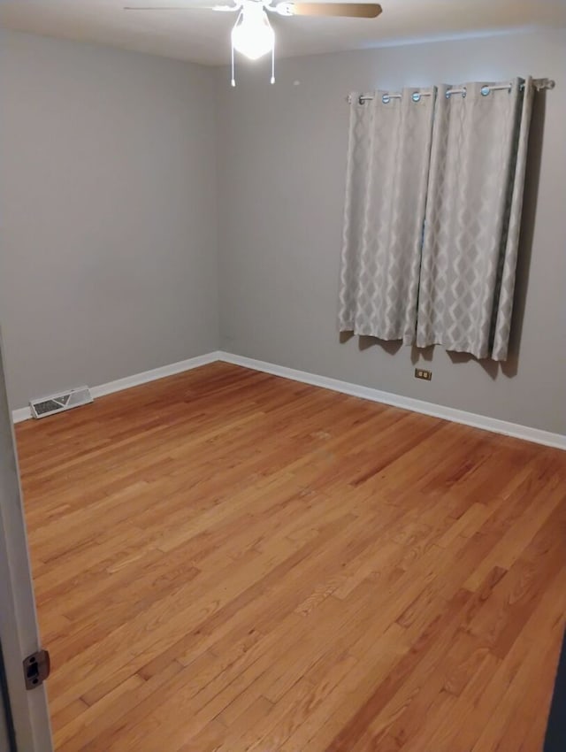 1544 Towhee Ln, Naperville, IL 60565 - unfurnished room with light wood-style floors and ceiling fan