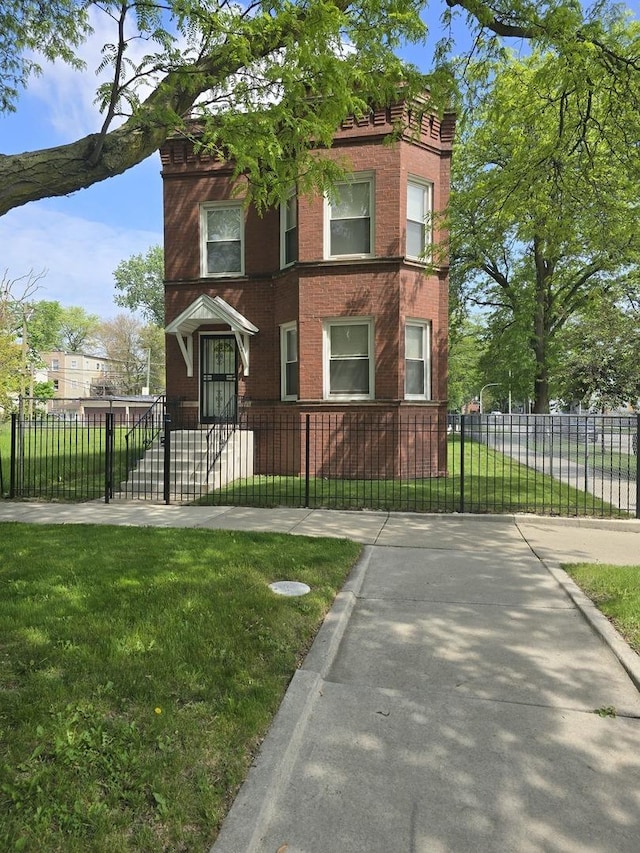 1244 E 70th St, Chicago, IL 60637 - view of front of home featuring brick siding, a fenced front yard, and a gate
