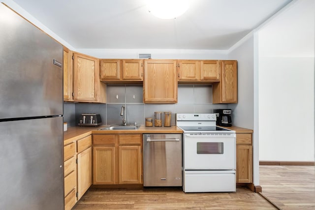 1030 N State St Unit 9G, Chicago, IL 60610 - kitchen with stainless steel appliances, light wood-type flooring, and light countertops