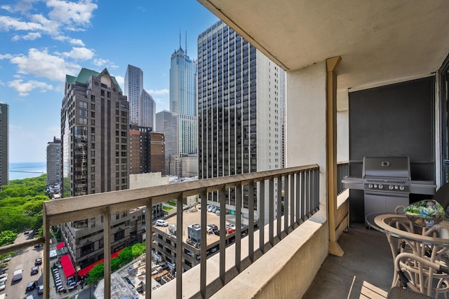 1030 N State St Unit 9G, Chicago, IL 60610 - balcony featuring a skyline view and a grill