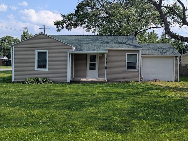 707 E Van Allen St, Tuscola, IL 61953 - view of front of house featuring a front yard, roof with shingles, and covered porch