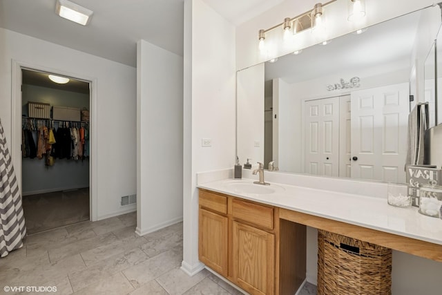 2714 Arbor Dr, Mchenry, IL 60050 - bathroom featuring vanity and a walk in closet