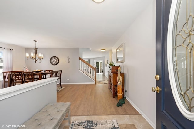 2714 Arbor Dr, Mchenry, IL 60050 - entrance foyer featuring a chandelier, plenty of natural light, stairway, and light wood-type flooring