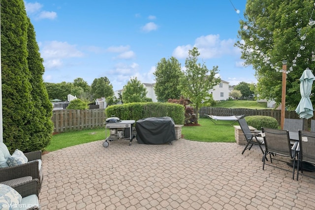 2714 Arbor Dr, Mchenry, IL 60050 - fenced backyard featuring area for grilling, a patio, and outdoor dining area