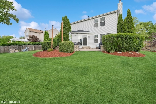 2714 Arbor Dr, Mchenry, IL 60050 - back of house featuring a chimney, a patio area, and entry steps