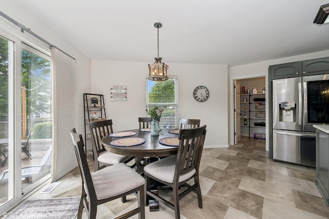 2714 Arbor Dr, Mchenry, IL 60050 - dining space featuring a chandelier and baseboards