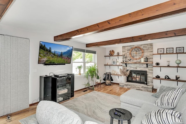 235 Fox Trail Ct, Bourbonnais, IL 60914 - living area featuring light wood finished floors, a stone fireplace, and beam ceiling