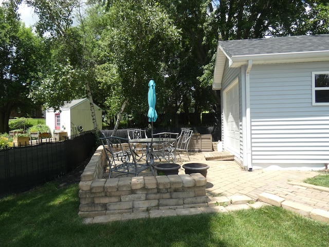 235 Fox Trail Ct, Bourbonnais, IL 60914 - view of patio featuring an outdoor structure and outdoor dining area