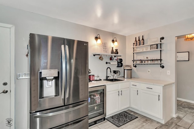 235 Fox Trail Ct, Bourbonnais, IL 60914 - kitchen with stainless steel refrigerator with ice dispenser, open shelves, beverage cooler, and white cabinets