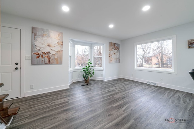 38236 N Lee Ave, Spring Grove, IL 60081 - unfurnished living room featuring dark wood-type flooring and recessed lighting