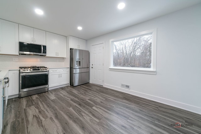 38236 N Lee Ave, Spring Grove, IL 60081 - kitchen with stainless steel appliances, white cabinetry, light countertops, dark wood-style flooring, and recessed lighting