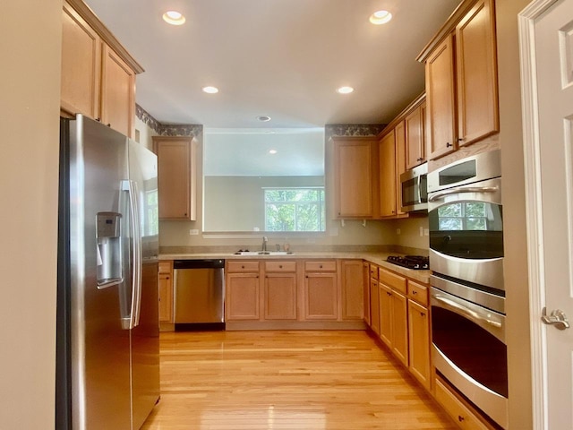 826 Bohannon Cir, Oswego, IL 60543 - kitchen featuring stainless steel appliances, light wood-style floors, light countertops, recessed lighting, and light brown cabinets