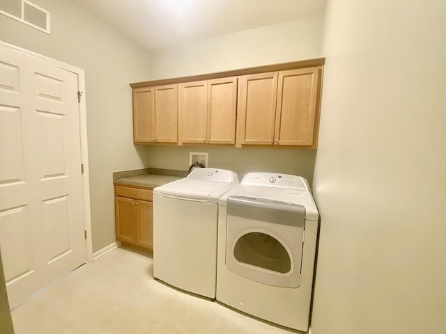 826 Bohannon Cir, Oswego, IL 60543 - washroom with cabinet space and separate washer and dryer