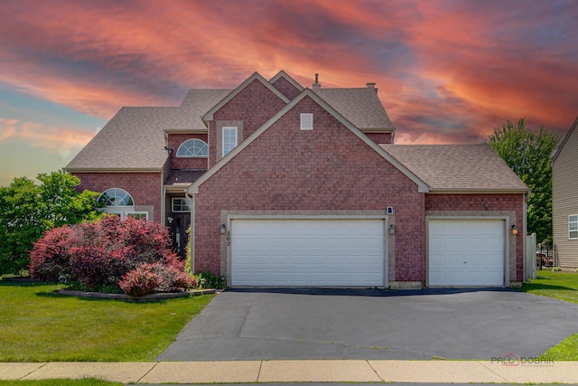 202 Dallas Dr, Bartlett, IL 60103 - traditional-style home with an attached garage, driveway, a shingled roof, and a lawn