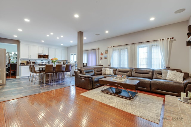 202 Dallas Dr, Bartlett, IL 60103 - living room with light wood-style floors and recessed lighting