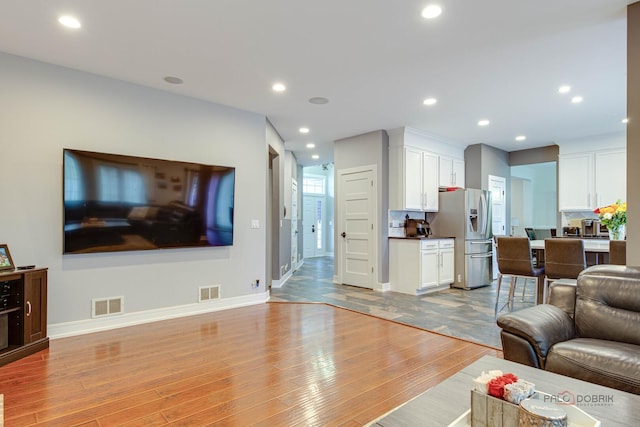 202 Dallas Dr, Bartlett, IL 60103 - living area featuring light wood-type flooring and recessed lighting