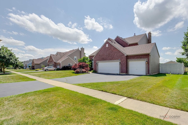 202 Dallas Dr, Bartlett, IL 60103 - view of front facade featuring brick siding, asphalt driveway, a garage, a residential view, and a chimney