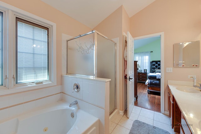 202 Dallas Dr, Bartlett, IL 60103 - full bathroom featuring ensuite bathroom, a stall shower, a jetted tub, vanity, and tile patterned floors