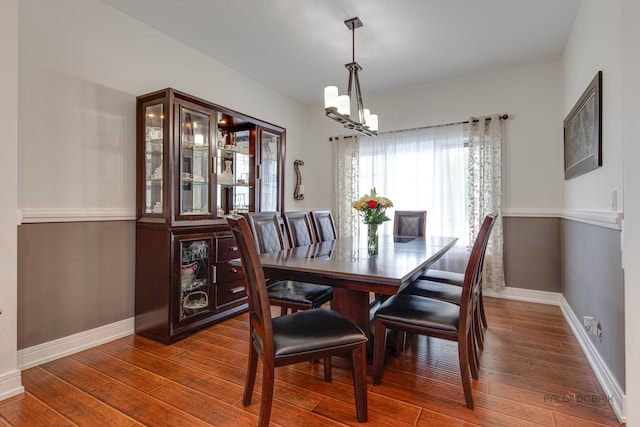202 Dallas Dr, Bartlett, IL 60103 - dining space with a chandelier and dark wood-style floors