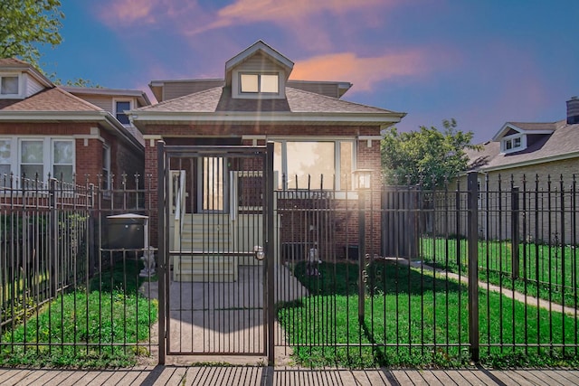 7505 S May St, Chicago, IL 60620 - bungalow-style house with a gate, a fenced front yard, brick siding, and roof with shingles