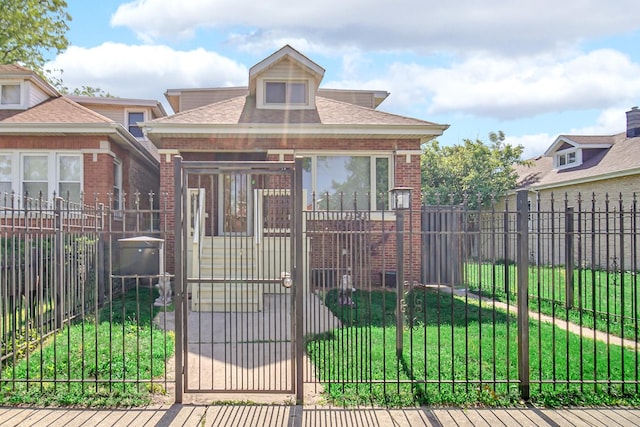 7505 S May St, Chicago, IL 60620 - bungalow-style home featuring a gate, brick siding, a fenced front yard, and roof with shingles