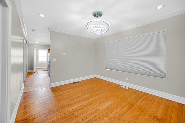 7505 S May St, Chicago, IL 60620 - empty room with ornamental molding, light wood-style flooring, a chandelier, and recessed lighting