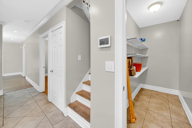 7505 S May St, Chicago, IL 60620 - hall with light tile patterned floors, stairs, and ornamental molding