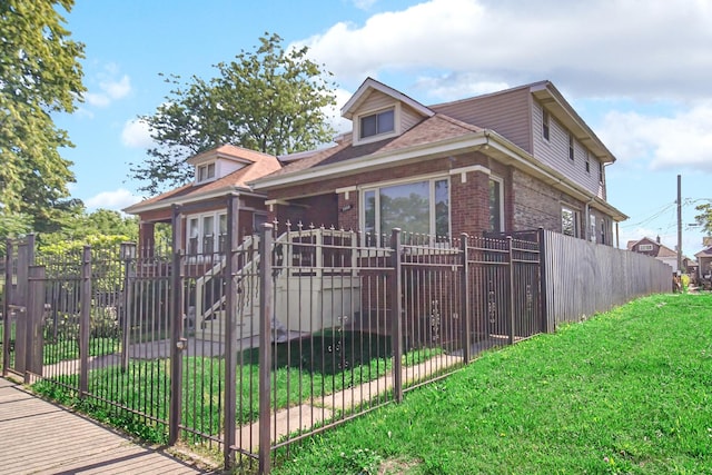 7505 S May St, Chicago, IL 60620 - bungalow-style home featuring a fenced front yard and brick siding
