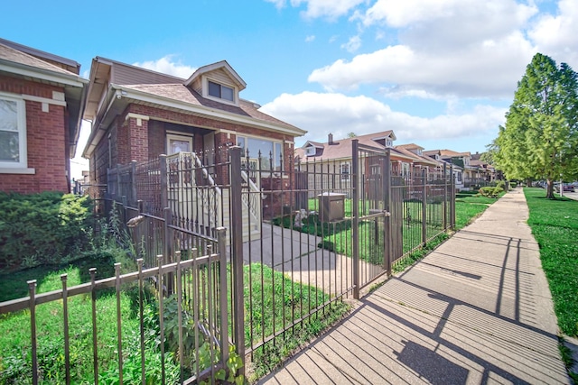 7505 S May St, Chicago, IL 60620 - view of property's community featuring a fenced front yard, a gate, and a residential view